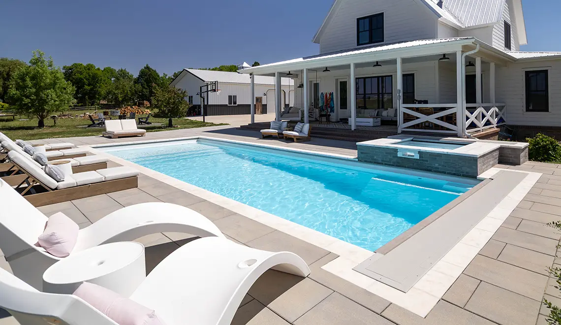 Leisure Pools Pinnacle large precast swimming pool with built-in splash deck