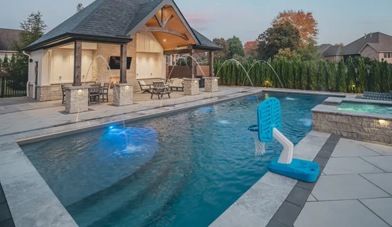 The Wave fiberglass pool with gazebo, pool house, and family backyard setting