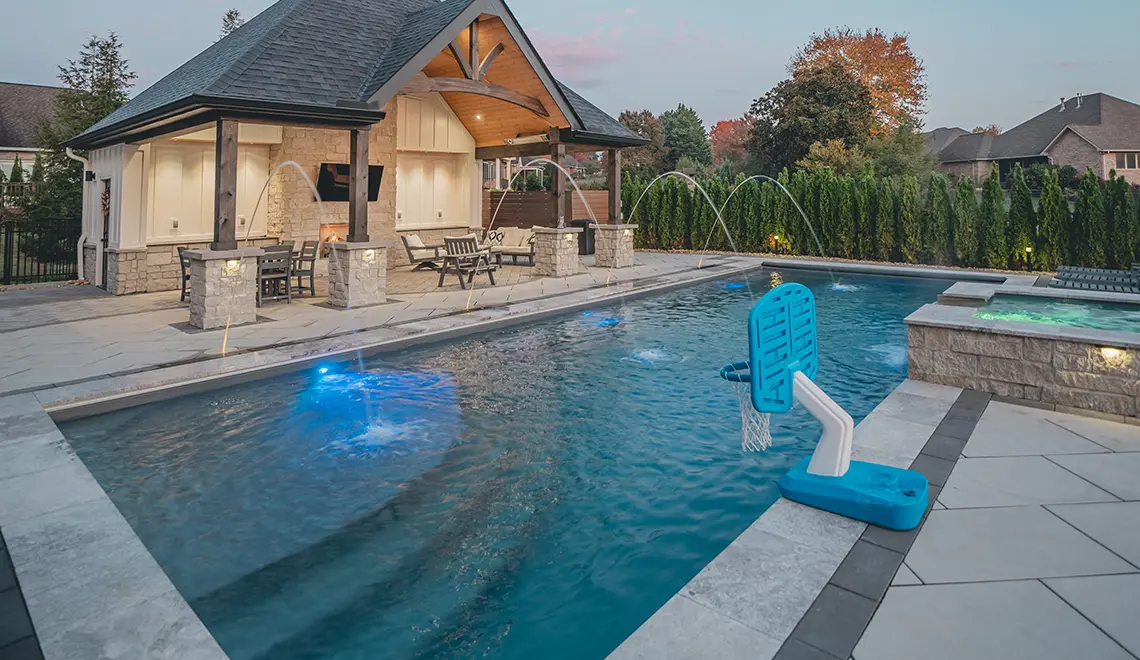 The Wave fiberglass pool with gazebo, pool house, and family backyard setting