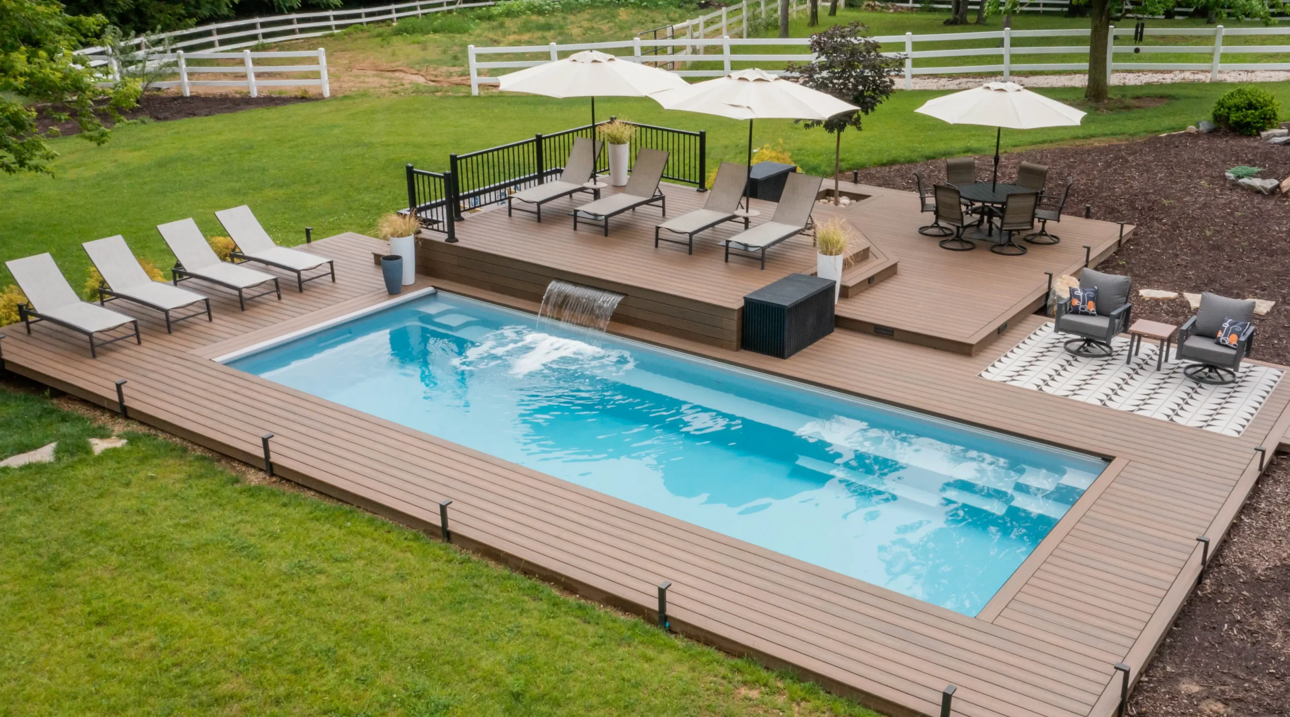 The Reflection rectangular fiberglass pool in Sapphire Blue