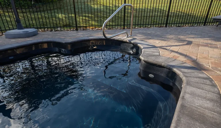 Detailed shot of Leisure Pools Roman model entry steps in Ebony Blue.