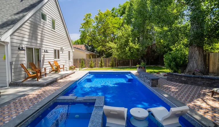 Leisure Pools Ultimate fiberglass swimming pool with built-in spa