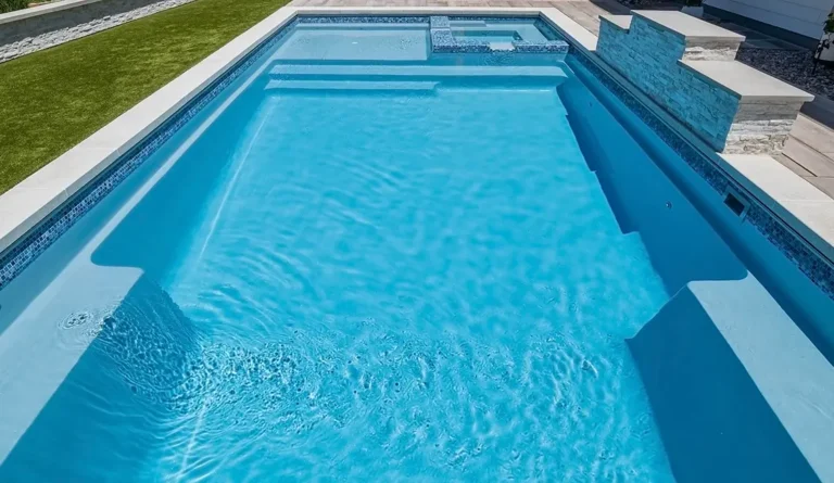 Leisure Pools Ultimate fiberglass swimming pool with built-in spa