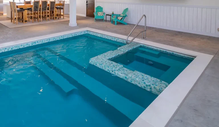 Leisure Pools Ultimate fiberglass swimming pool with built-in spa