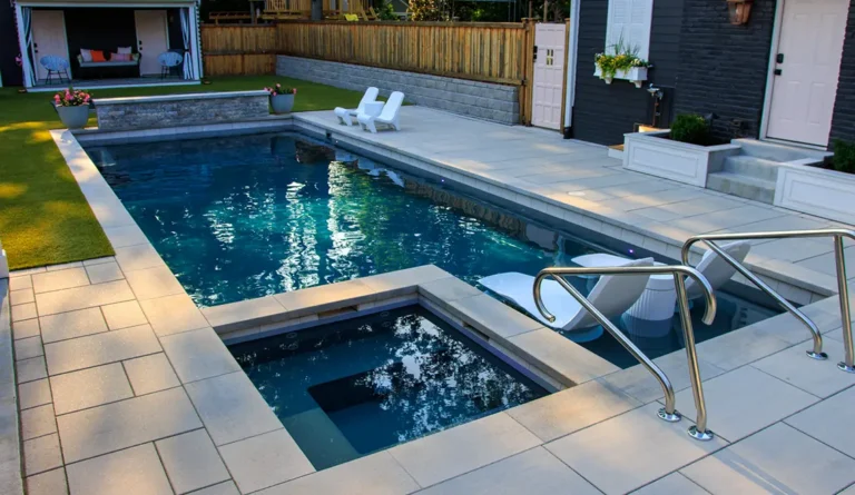 Leisure Pools Ultimate 40-foot fiberglass inground pool with built-in spa and splash deck