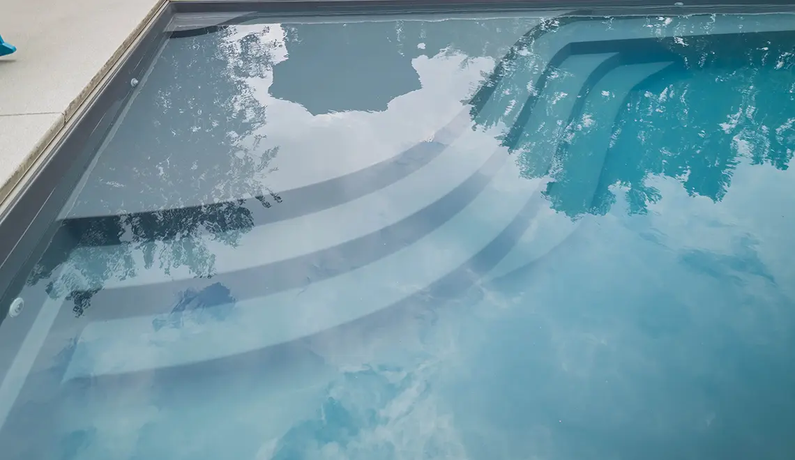 The Wave fiberglass pool curved tanning ledge and entry steps detail