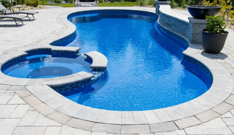 The Allure 40 inground fiberglass pool with deep end swimout bench in Sapphire Blue