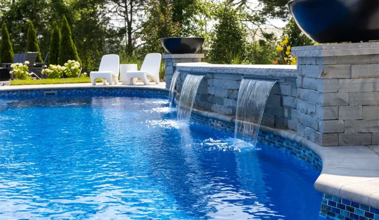 The Allure 40 fiberglass pool integrated spa with spillover detail in Sapphire Blue