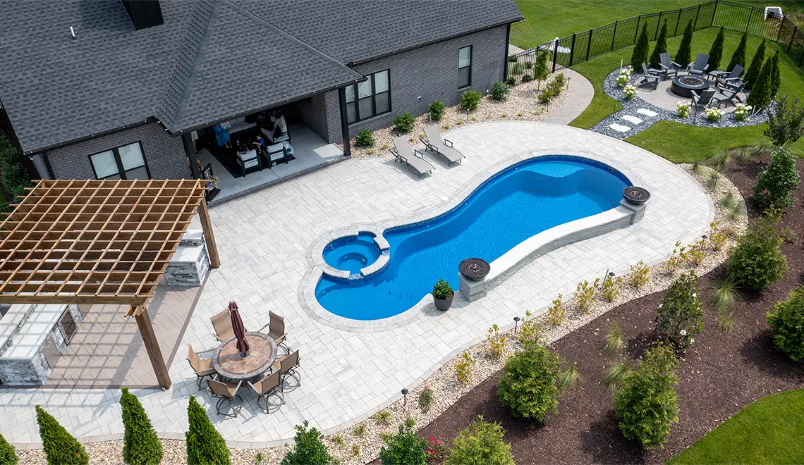 Leisure Pools Allure large freeform inground fiberglass pool in Sapphire Blue Color