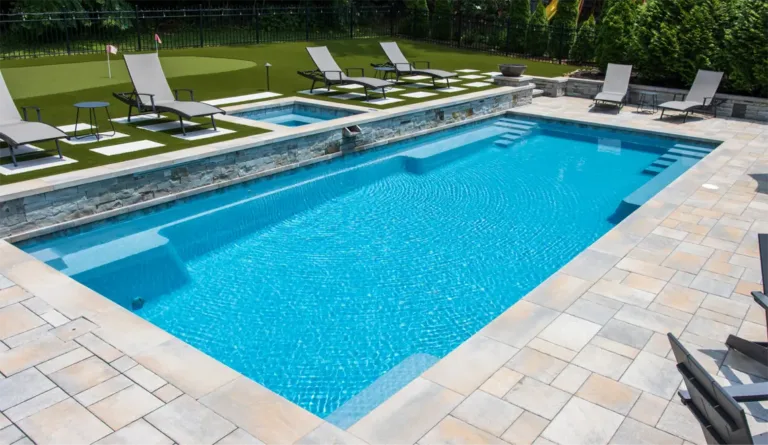The Supreme fiberglass pool installed with full patio surround and landscaping