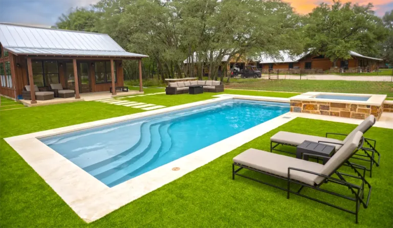 The Wave fiberglass pool with outdoor pavilion and stepping stone pathway