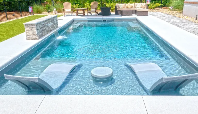 The Summit fiberglass pool swim out benches and splash deck detail in Graphite Grey