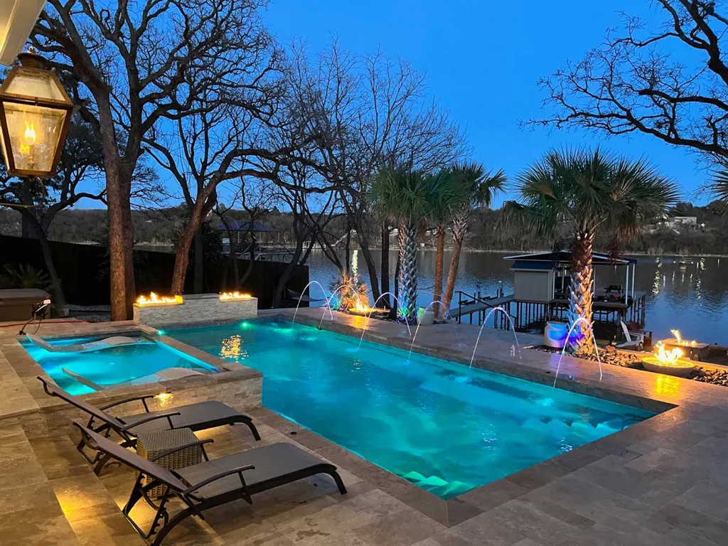 Leisure-DFW-Fiberglass-Pool-Builder-Supreme Nightime view of fiberglass pool, installed by Leisure Pools DFW