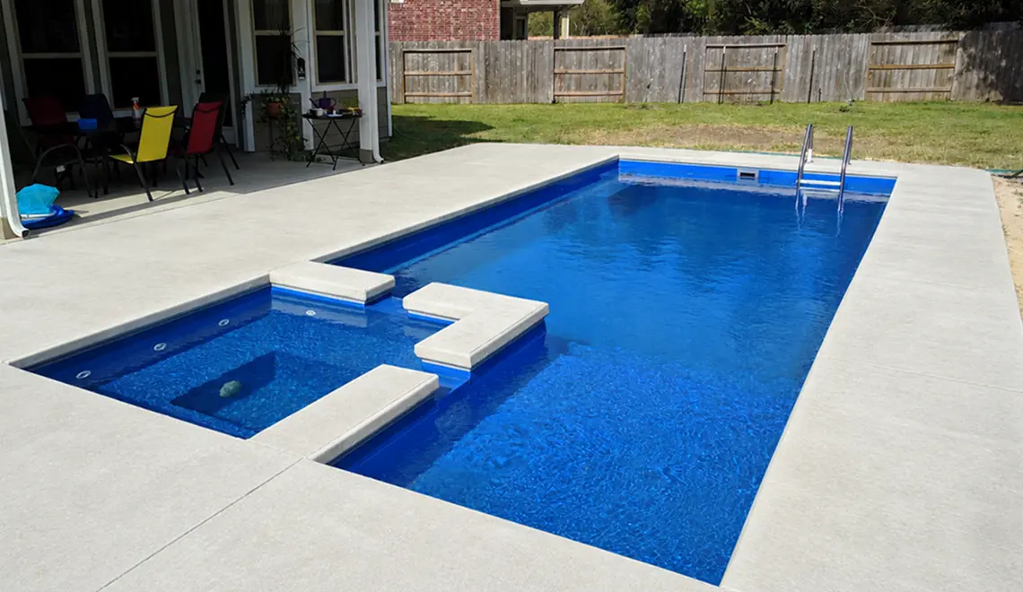 The Limitless compact fiberglass pool swim out bench steps detail in Sapphire Blue