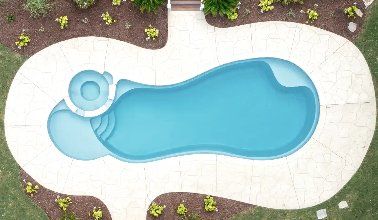 Color preview of The Allure™ in Shimmer Sky, showing a round built-in spa and submerged seating within flowing curves.