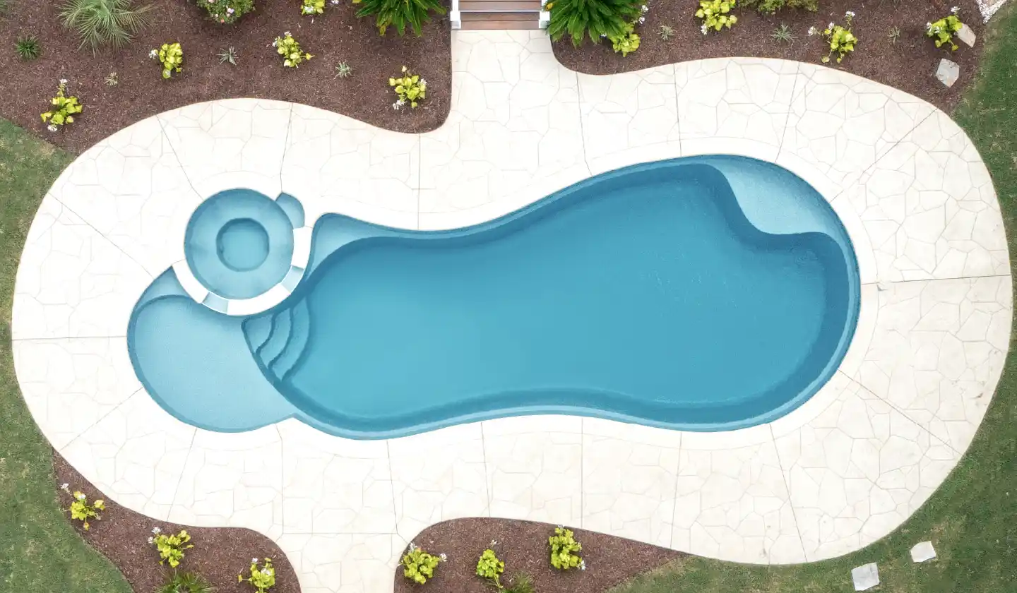 Overhead view of The Allure™ in Silver Grey, showing a curved splash deck connecting the spa and main swimming area.