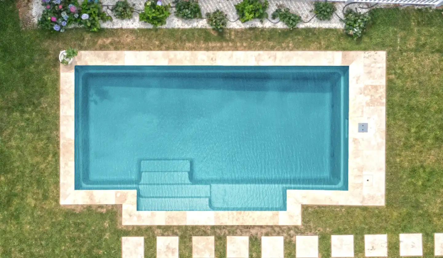The Elegance™ shown in Aquamarine, featuring a rectangular swim channel and extended stepped side entry.