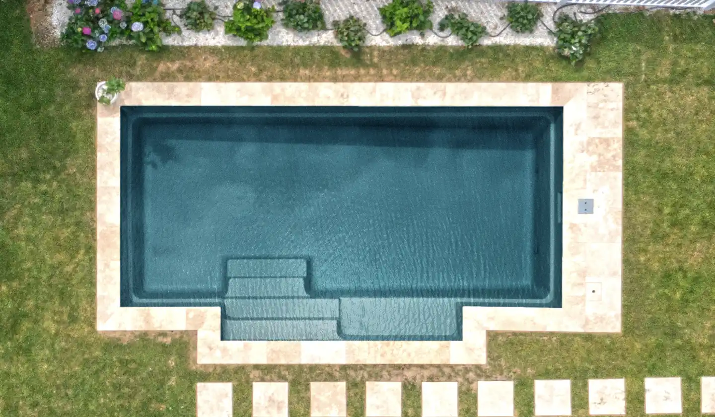 Color preview of The Elegance™ in Ebony Blue, showing an extended entry, seating nook and open rectangular swim space.