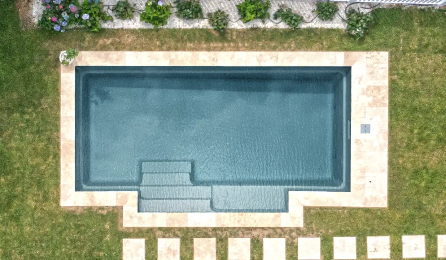 Overhead view of The Elegance™ in Graphite Grey, showing broad side-entry steps leading into the swimming corridor.