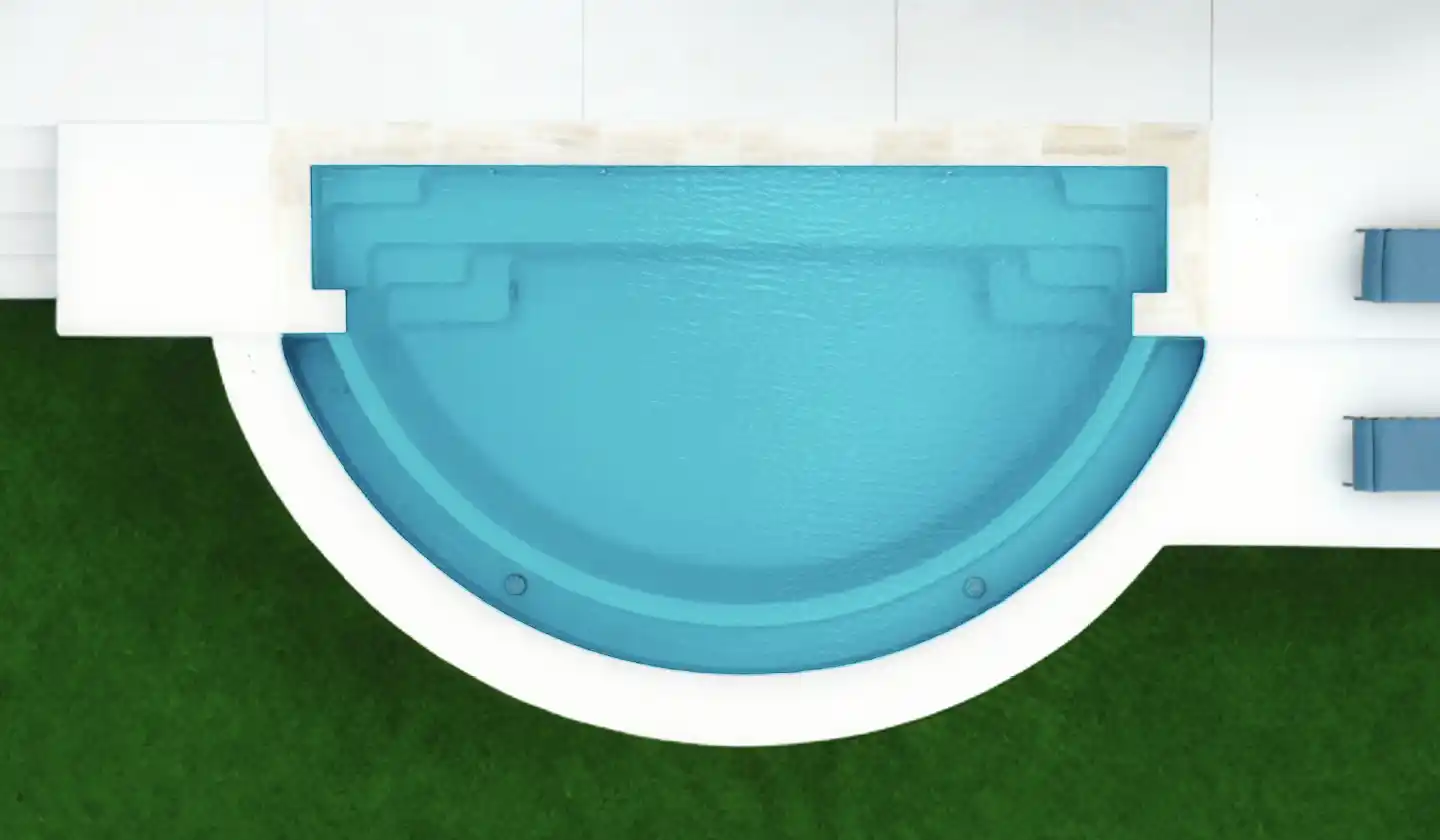 Overhead view of The Horizon™ fiberglass pool in Aquamarine, with a half-moon outline, curved spillover edge and submerged seating.