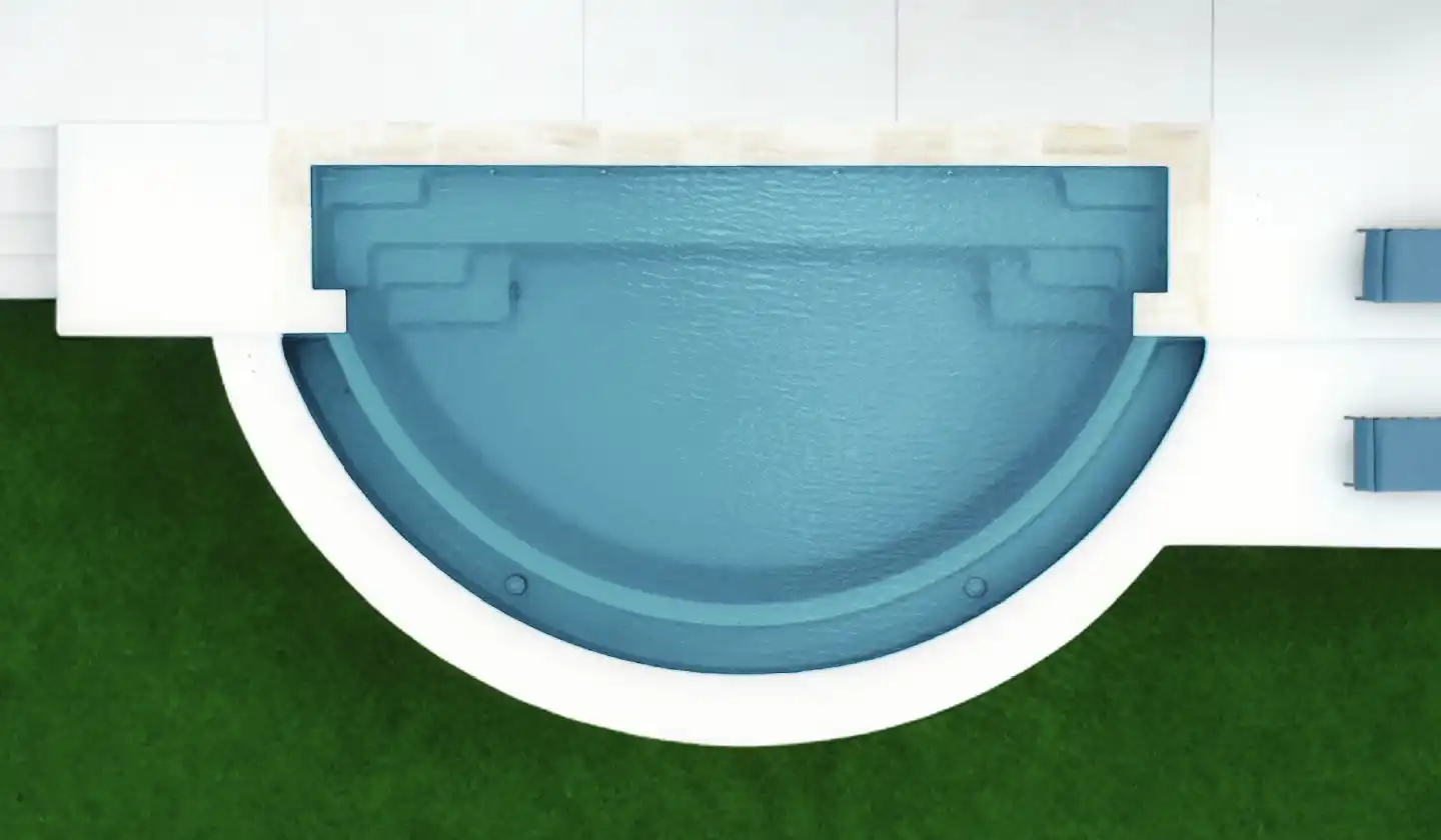 The Horizon™ fiberglass pool in Graphite Grey, with a sweeping curved edge and seating along the straight side.