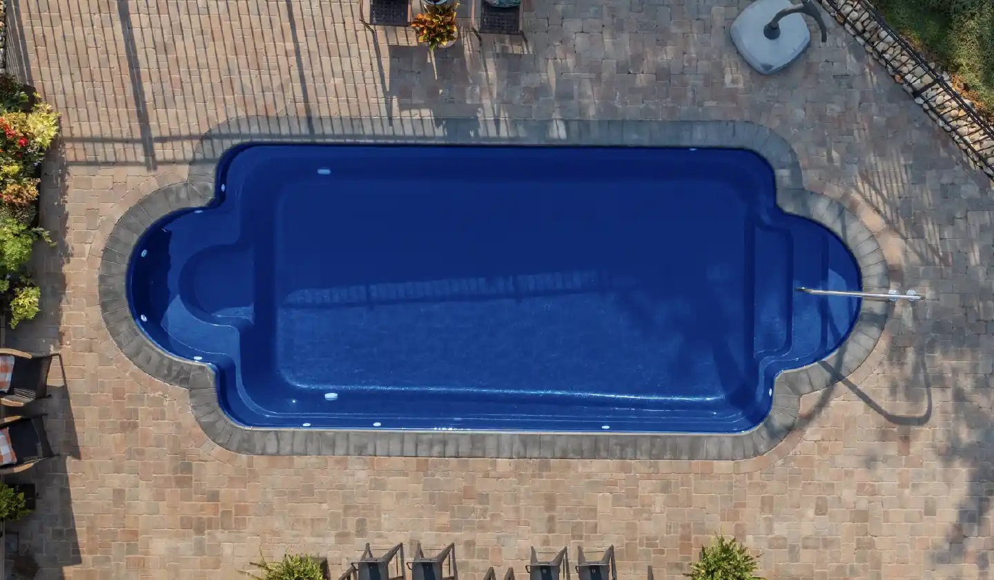 The Roman™ shown in Sapphire Blue, featuring a long swimming space with symmetrical curved end features.